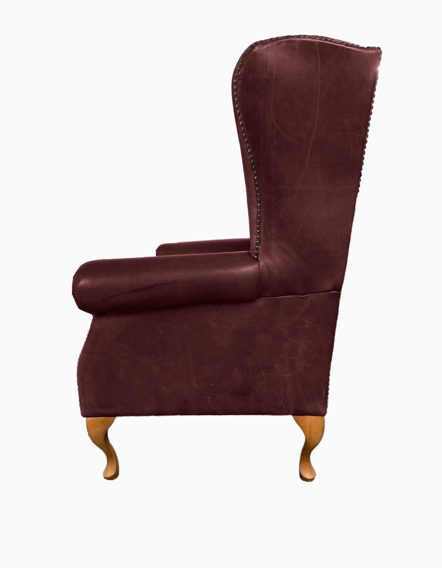 Chesterfield High Back Wing chair and Stool - Presented In Genuine Vintage Red Leather - The Kensington
