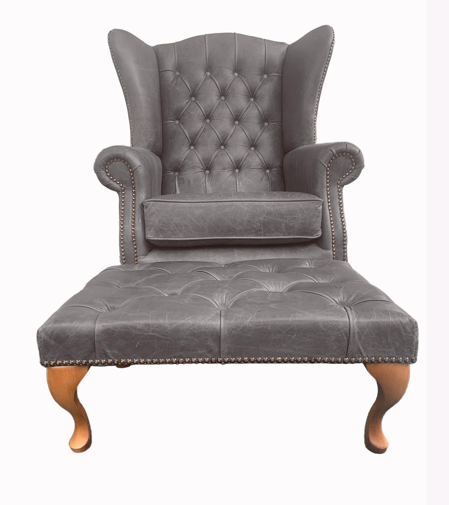 Chesterfield High Back Wing chair and Stool - Presented In Genuine Vintage Ash Leather - The Kensington