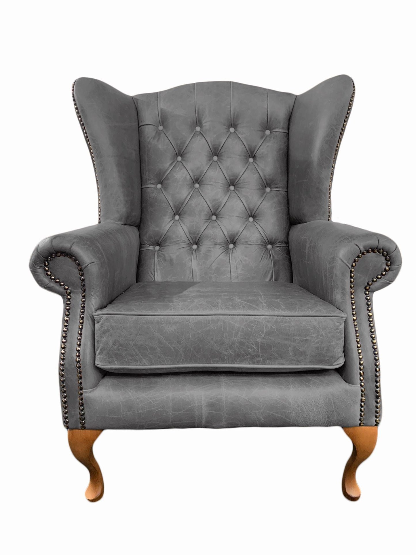 Chesterfield High Back Wing chair and Stool - Presented In Genuine Vintage Ash Leather - The Kensington
