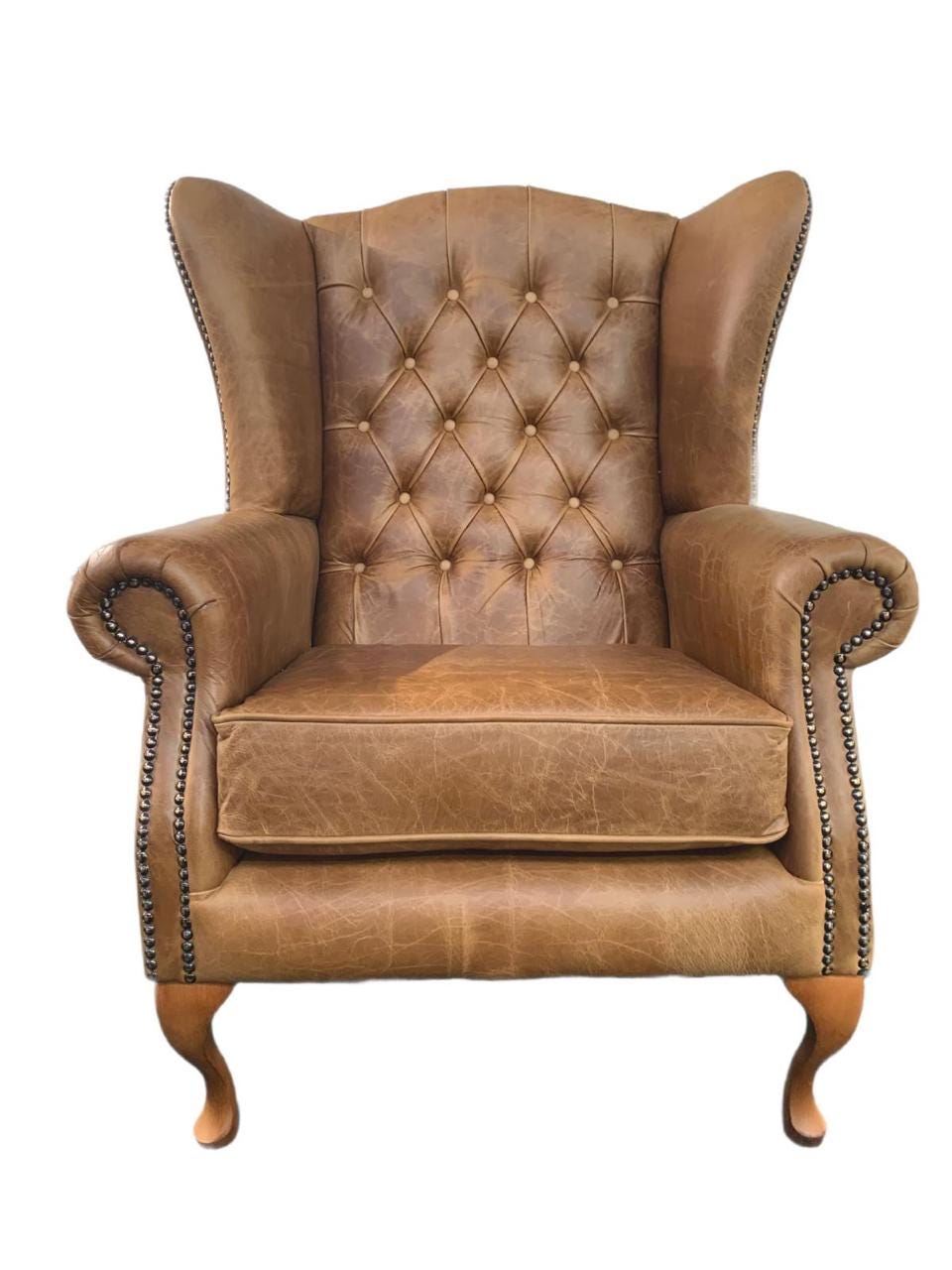 Chesterfield High Back Wing chair and Stool - Presented In Genuine Vintage Tan Leather - The Kensington