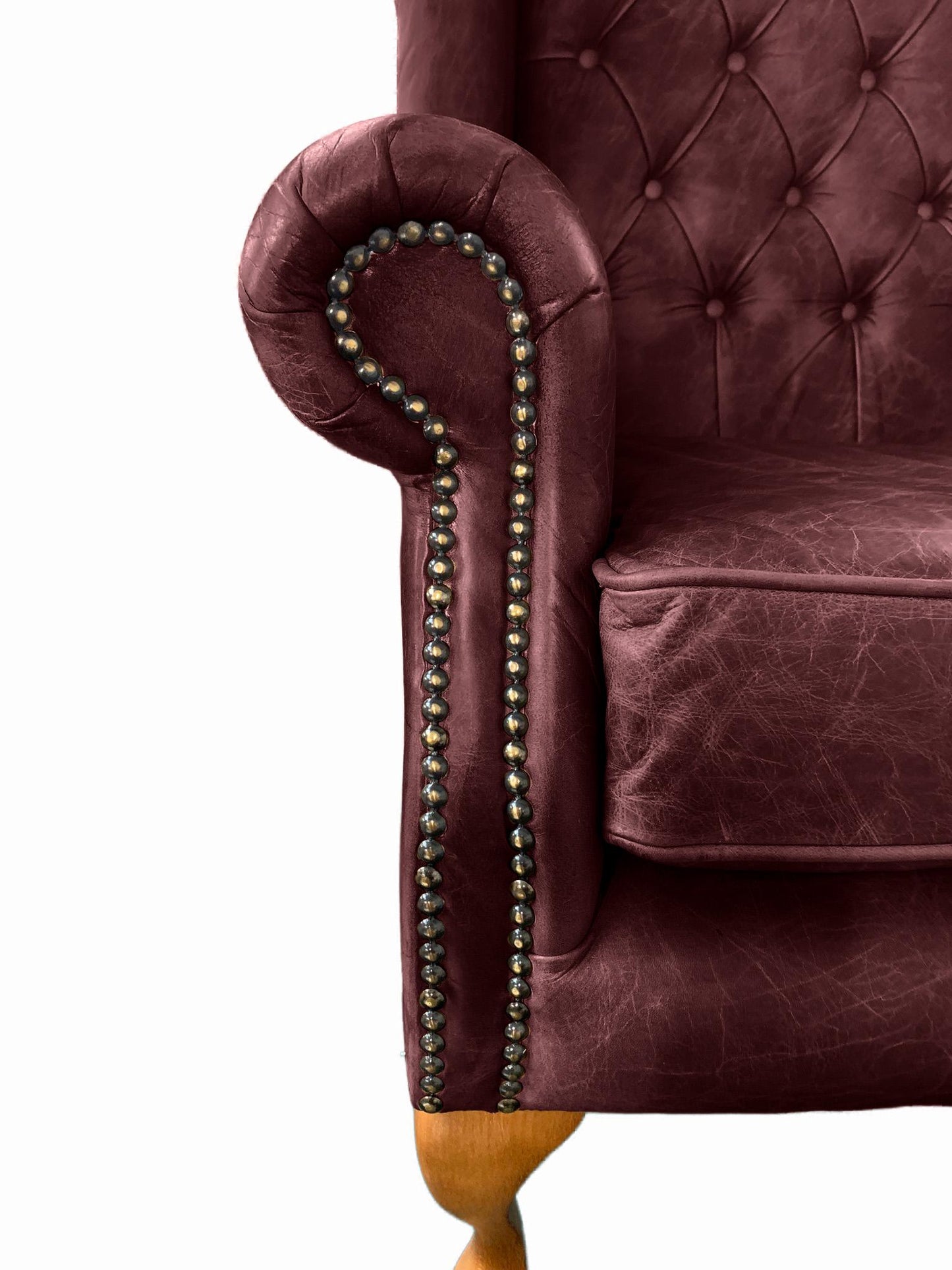 Chesterfield High Back Wing chair and Stool - Presented In Genuine Vintage Red Leather - The Kensington