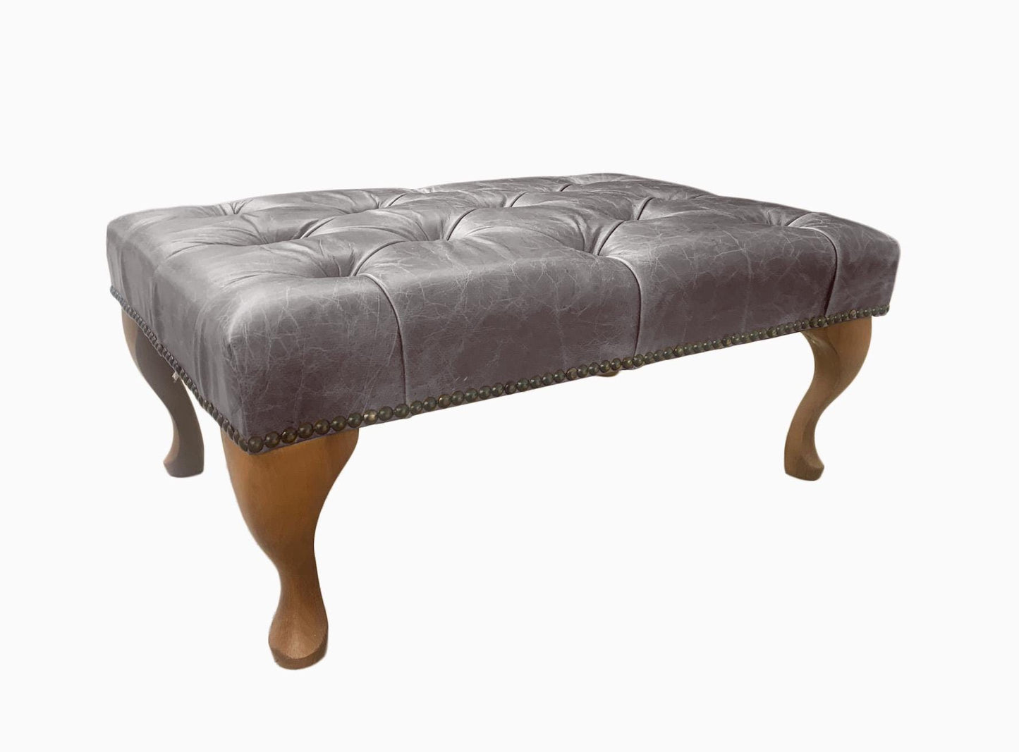 Chesterfield High Back Wing chair and Stool - Presented In Genuine Vintage Ash Leather - The Kensington
