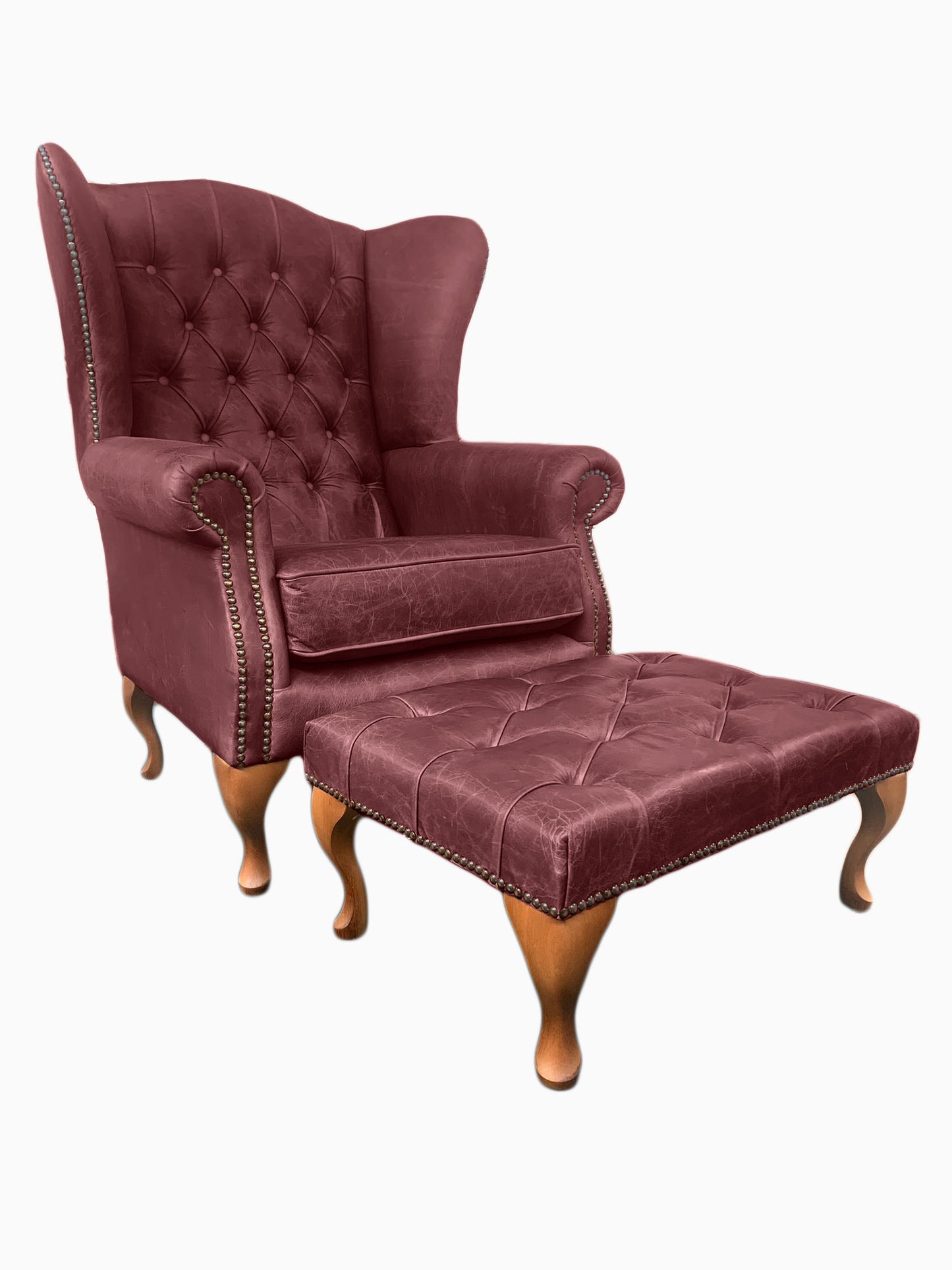 Chesterfield High Back Wing chair and Stool - Presented In Genuine Vintage Red Leather - The Kensington