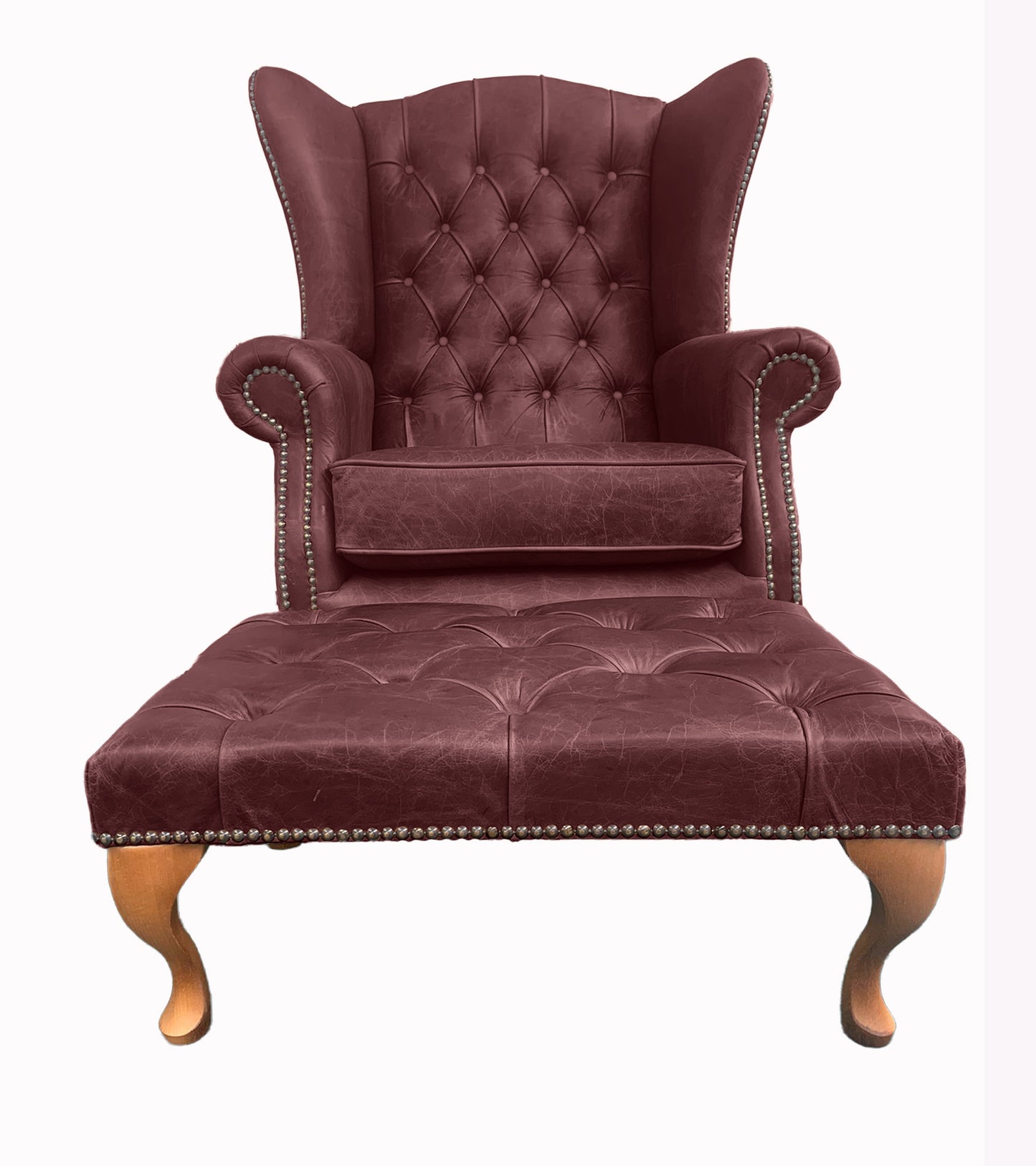 Chesterfield High Back Wing chair and Stool - Presented In Genuine Vintage Red Leather - The Kensington