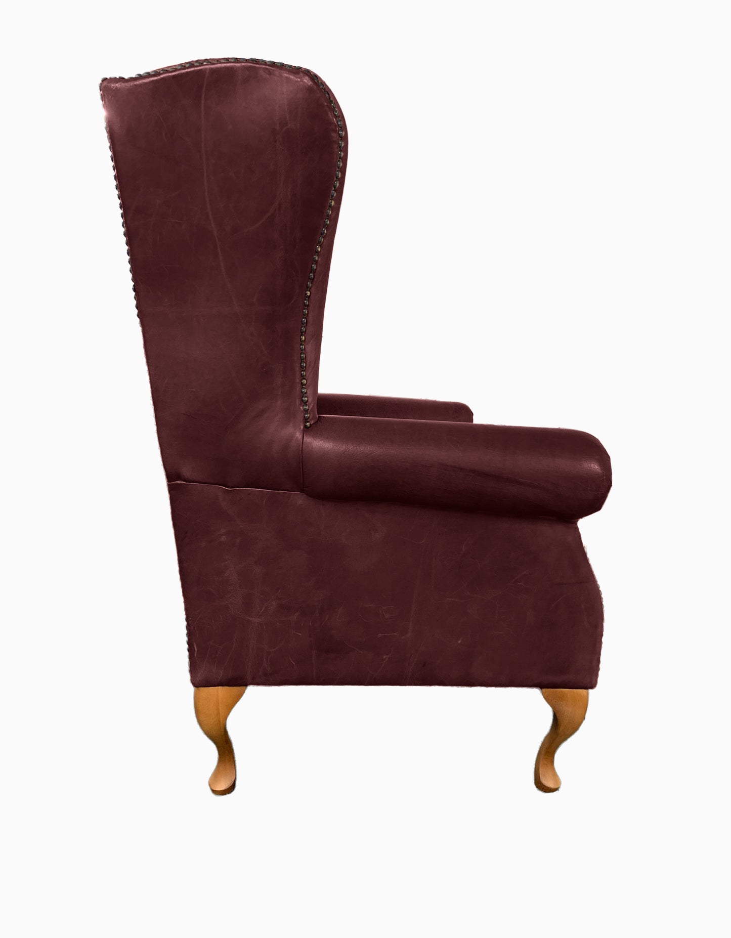 Chesterfield High Back Wing chair and Stool - Presented In Genuine Vintage Red Leather - The Kensington