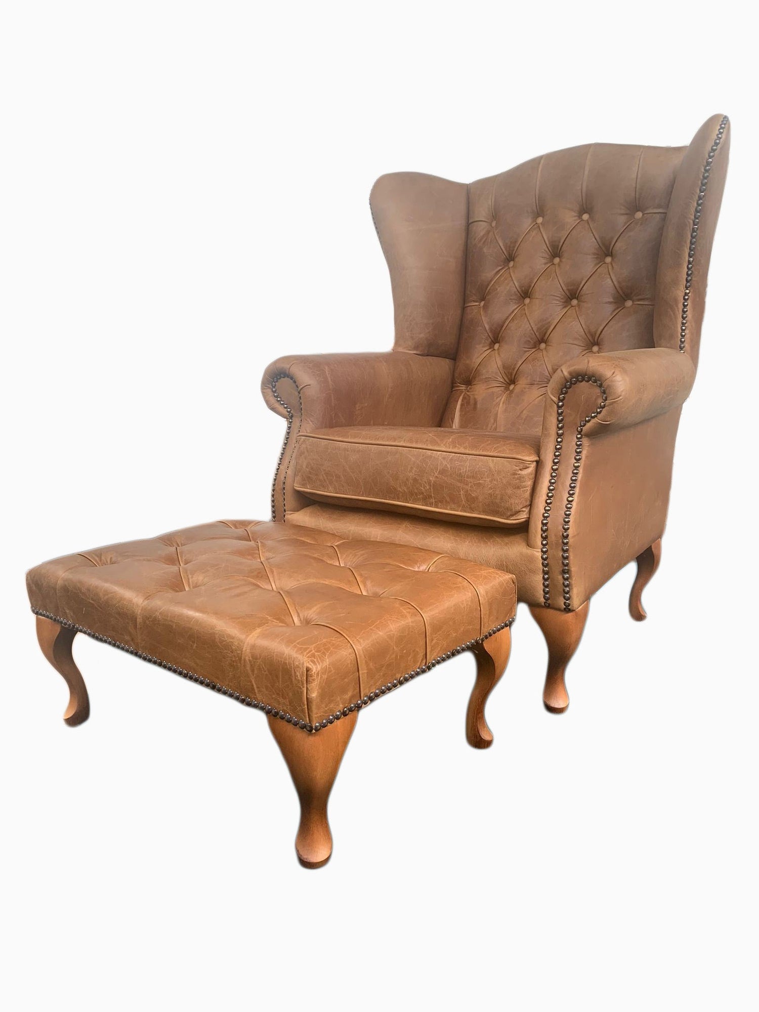 Chesterfield High Back Wing chair and Stool - Presented In Genuine Vintage Leather - The Kensington