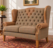 Harris Tweed and leather wingback two seater sofa, angled view